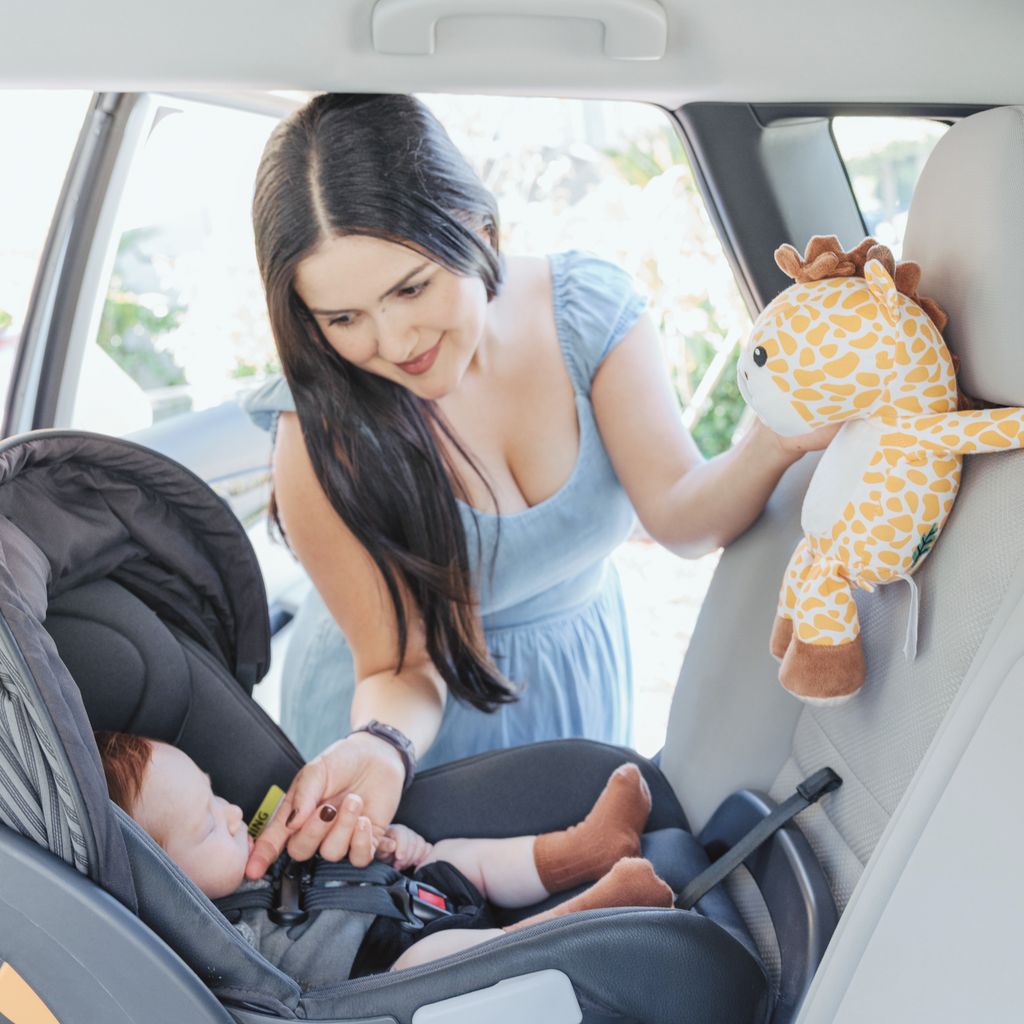 Infanttech zooby® baby monitor with Jordan Giraffe plush toy, showcasing a soft, colorful giraffe design for infant monitoring.
