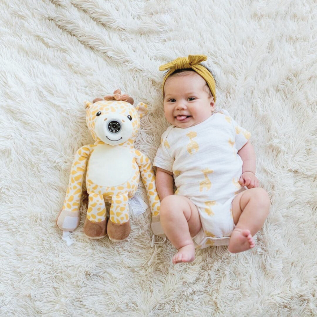 Zooby® baby monitor featuring Jordan Giraffe plush toy by infanttech, with monitor screen and giraffe design for baby care.