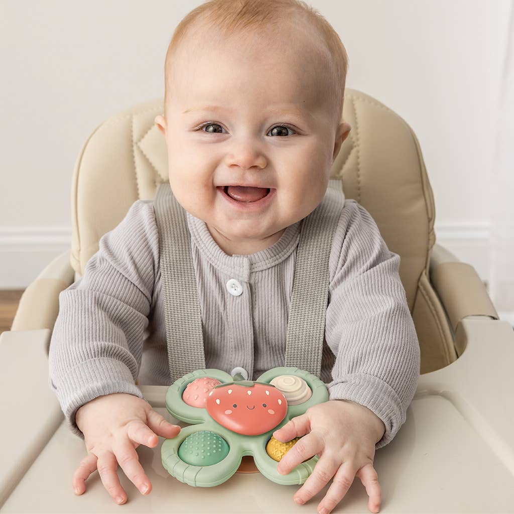 Itzy Pop & Whirl™ Strawberry toy by Olita Gifts & Goods featuring colorful spinning and popping elements for kids.