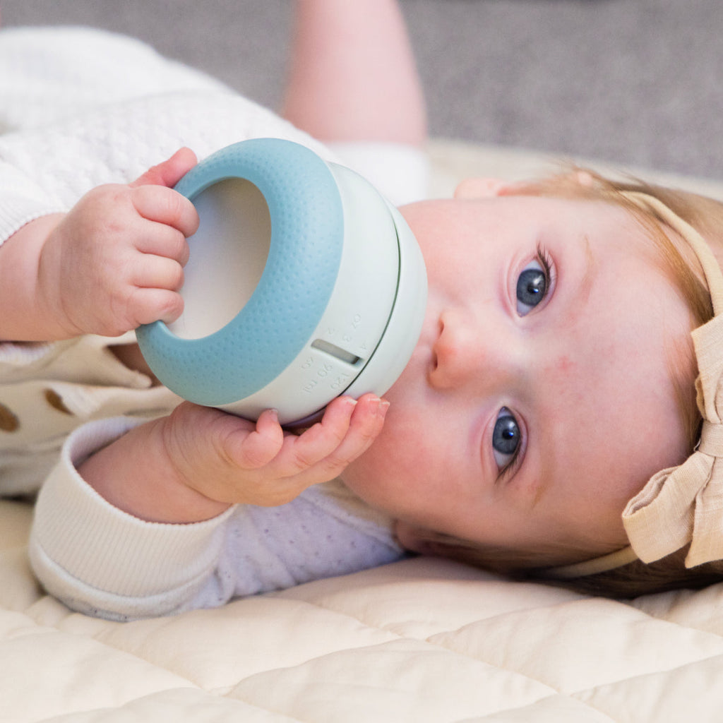 Set of three Babaloo bottles with colorful caps, designed for easy grip and feeding, perfect for infants and toddlers.