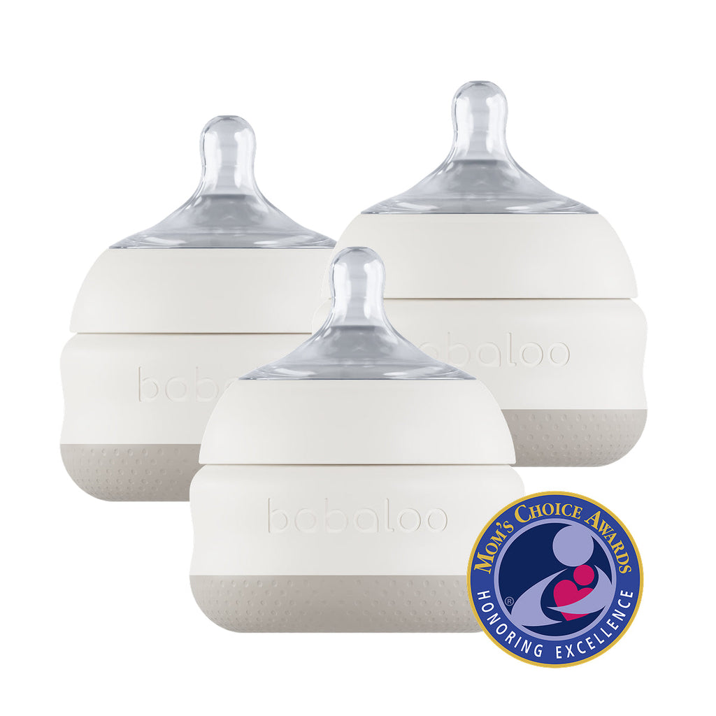 Set of three Babaloo baby bottles with 5oz capacity, clear plastic construction, and silicone nipples for feeding infants.