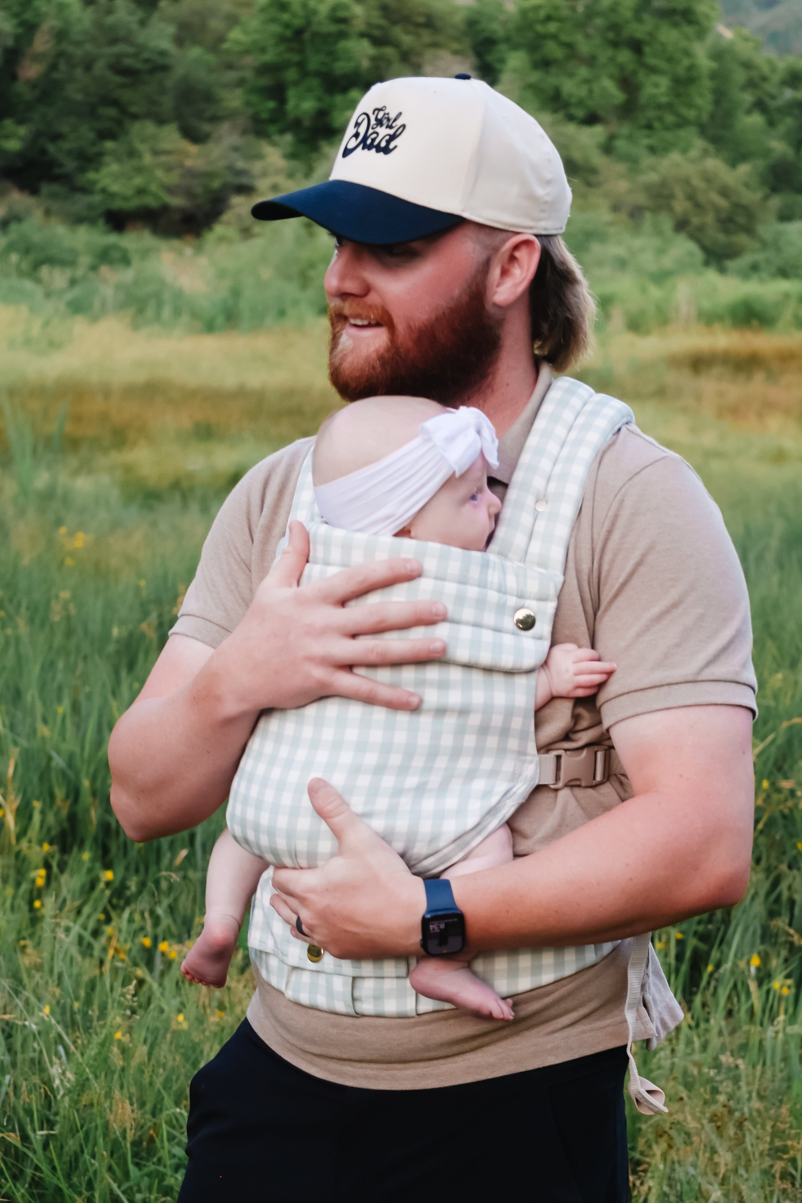 Coco Gingham baby carrier by Coco Carriers with a front pocket, featuring a stylish gingham pattern and adjustable straps.