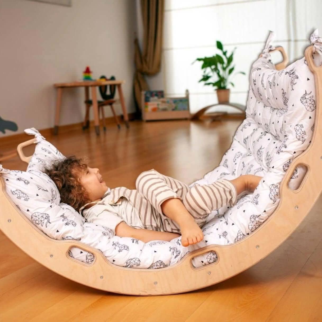 Kidodido climbing arch and rocker with origami pattern pillow, colorful foam play structure for kids' indoor activity and climbing fun.