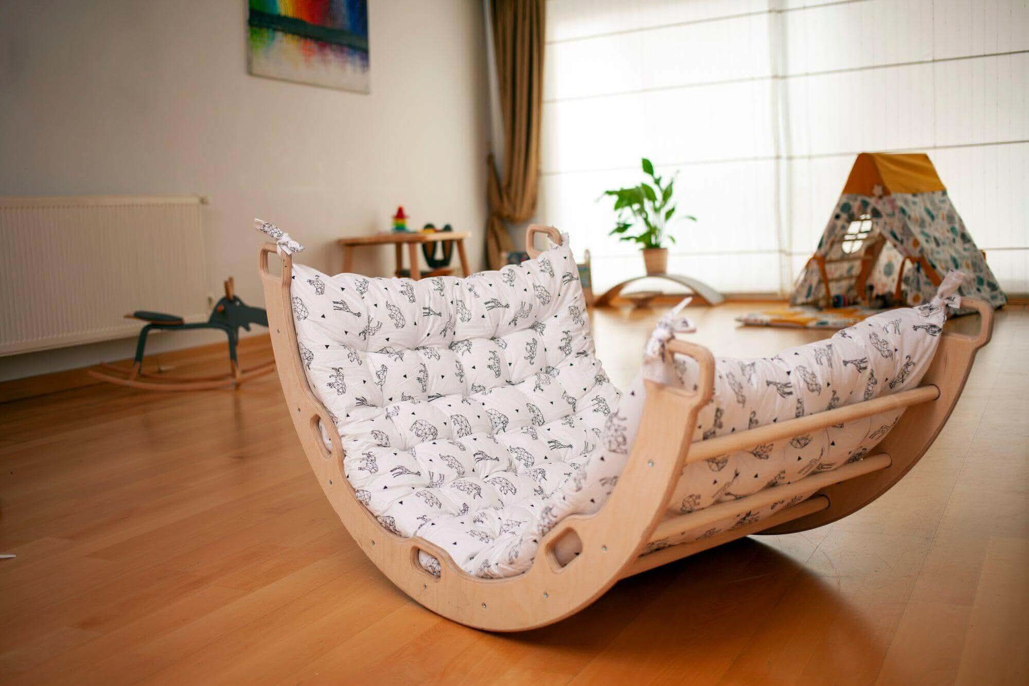 Kidodido climbing arch and rocker with origami pattern pillow, colorful foam play structure for kids' indoor activity and climbing fun.