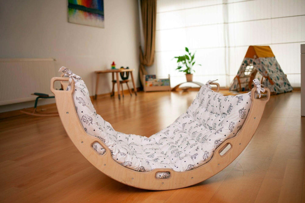 Kidodido climbing arch and rocker with origami pattern pillow, featuring colorful, soft foam for indoor play and sensory development.