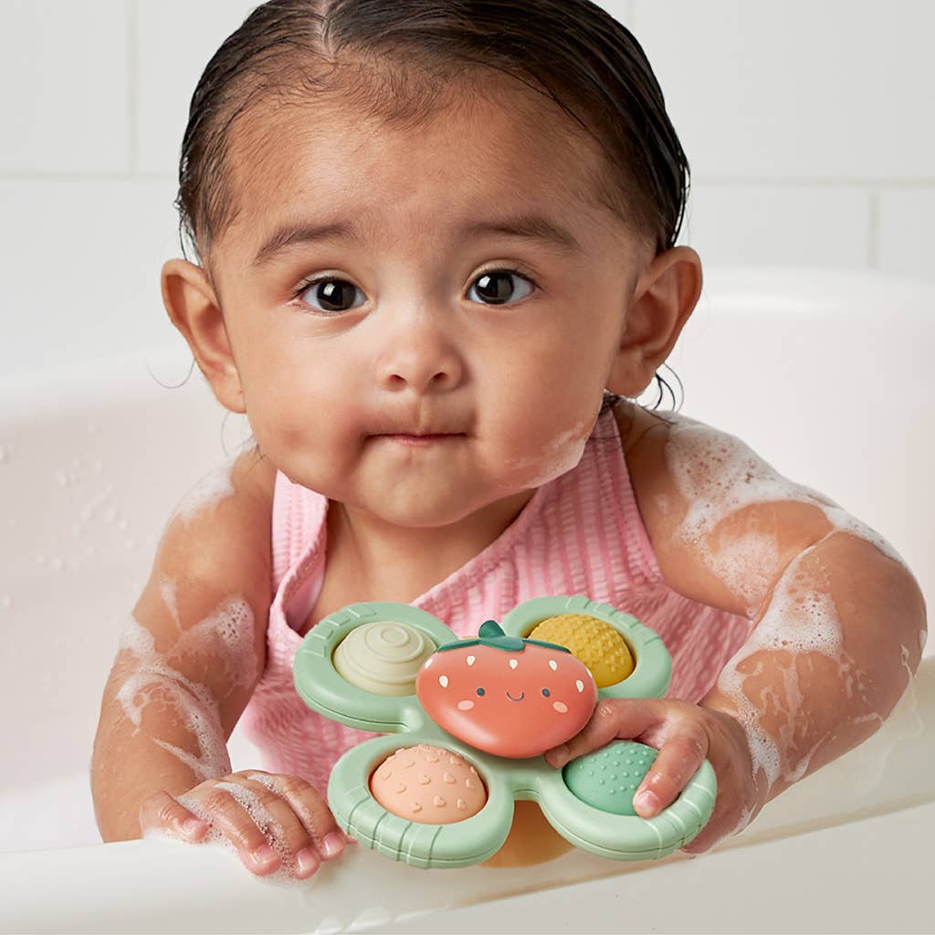 Itzy Pop & Whirl™ Strawberry toy by Olita Gifts & Goods with colorful swirl design and vibrant strawberry colors.
